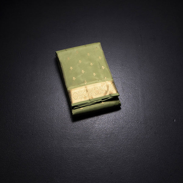 KSSMLSR42479-1-Pista-Green-Silk-Saree-With-Floral-Zari-Buttas-And-Gold-Zari-Border-02-fold