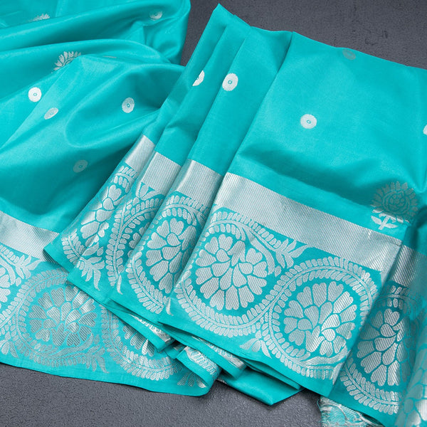 Turquoise Blue Soft Silk Saree With Chakra Buttas And Floral Silver Zari Border
