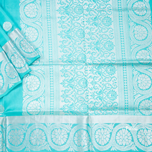 Turquoise Blue Soft Silk Saree With Chakra Buttas And Floral Silver Zari Border