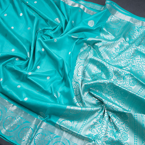 Turquoise Blue Soft Silk Saree With Chakra Buttas And Floral Silver Zari Border
