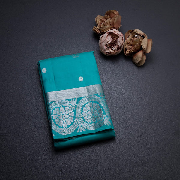 Turquoise Blue Soft Silk Saree With Chakra Buttas And Floral Silver Zari Border