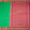 Pure Silk Parrot Green Saree With Gold Zari Buttas And Contrast Border - Kumaran Silks