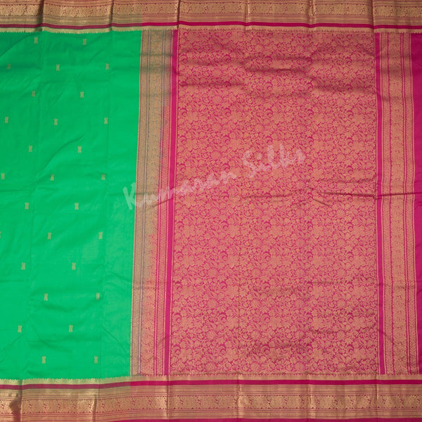 Pure Silk Parrot Green Saree With Gold Zari Buttas And Contrast Border - Kumaran Silks