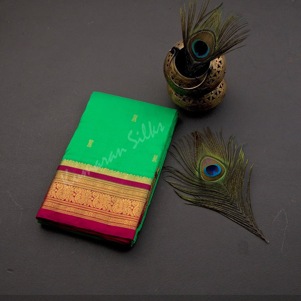 Pure Silk Parrot Green Saree With Gold Zari Buttas And Contrast Border