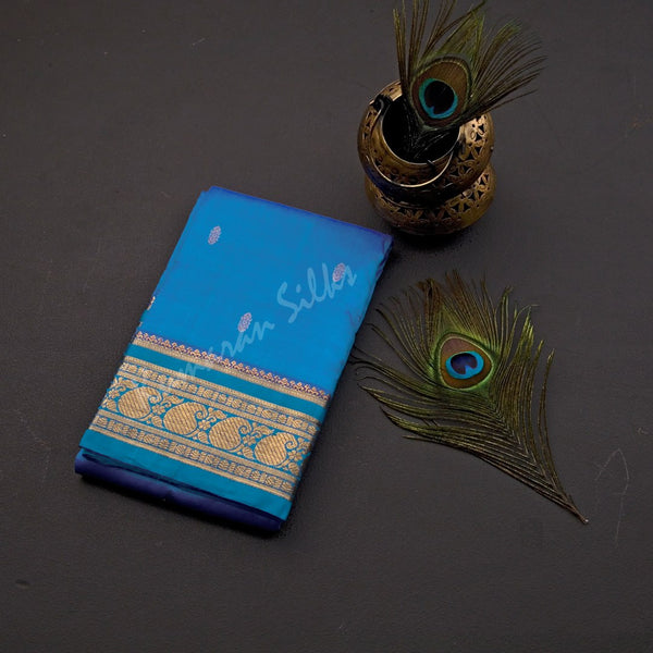 Pure Silk Azure Blue Saree With Gold Zari Buttas And Blue Border