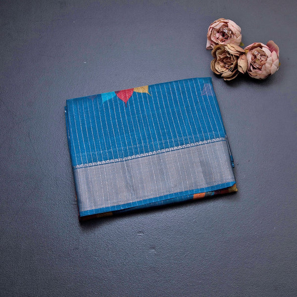 Semi Raw Silk Peacock Blue Printed With Zari Stripes Saree