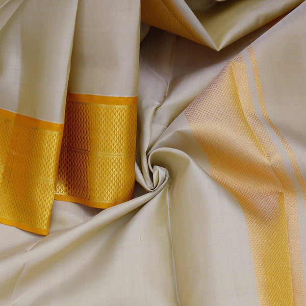 Biscuit Colour Silk Dhoti With Mayil Kannu Yellow Border - Kumaran Silks