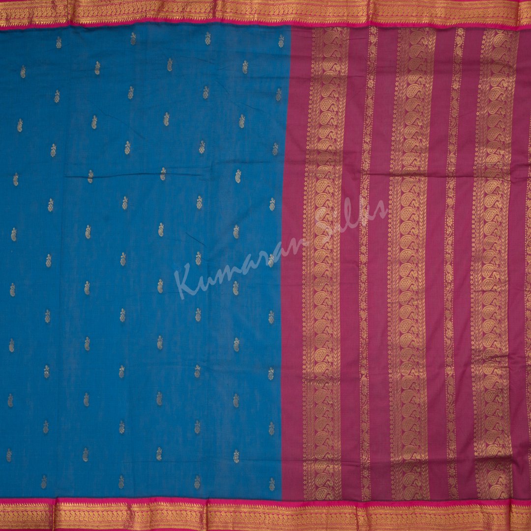 Kalyani Cotton Blue Saree With Small Buttas On The Body And Peacock Motif On The Pallu