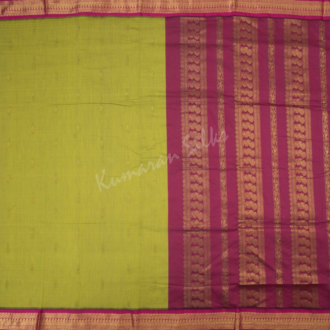 Kalyani Cotton Lime Green Saree With Small Buttas On The Body And Peacock Motif On The Pallu