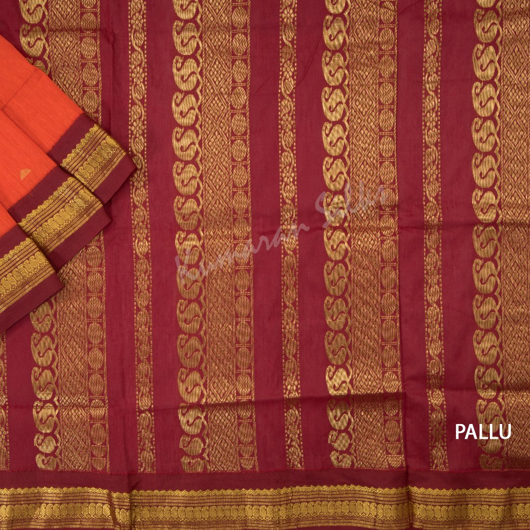 Kalyani Cotton Dark Orange Saree With Small Buttas On The Body And Mango And Chakra Motif On The Pallu