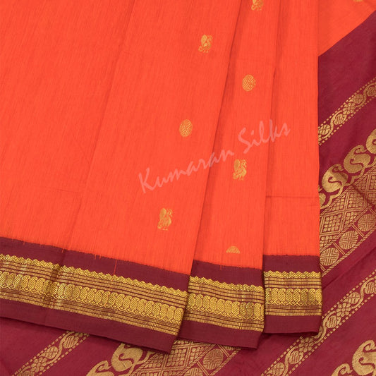 Kalyani Cotton Dark Orange Saree With Small Buttas On The Body And Mango And Chakra Motif On The Pallu