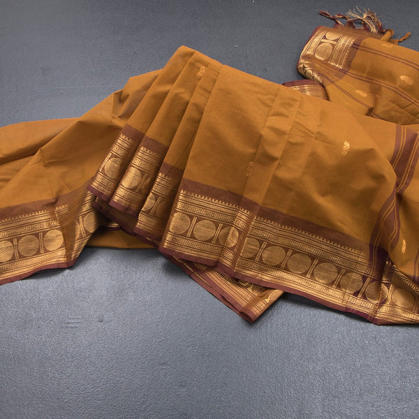 Kanchi Cotton Golden Brown Saree With Zari Buttas And Zari Border