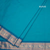 Kanchi Cotton Peacock Blue Saree With Thread Buttas And Zari Border