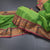 Kanchi Cotton Parrot Green Saree With Thread Buttas And Zari Border
