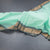 Kanchi Cotton Mint Green Plain Saree And Temple Border
