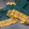 Kanchi Cotton Dark Green Saree With Zari Buttas And Zari Border