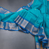 Kanchi Cotton Peacock Blue Saree With Thread Buttas And Zari Border 02