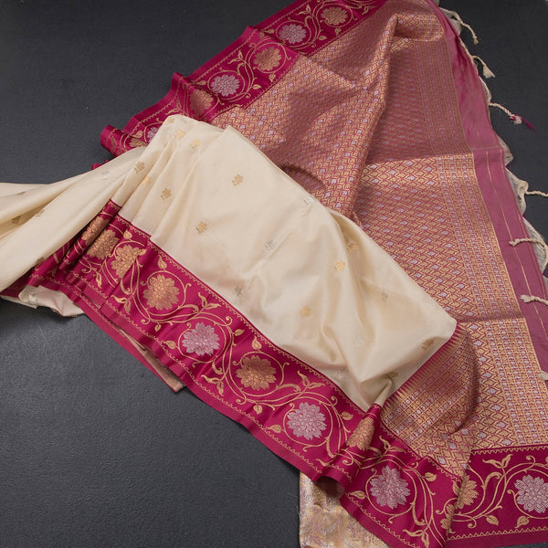 Art Silk Cream Saree With Zari Buttas And Floral Border