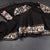 KSRTSR42270-Raw-Silk-Black-Saree-With-Zari-Buttas-And-Thread-Border-main