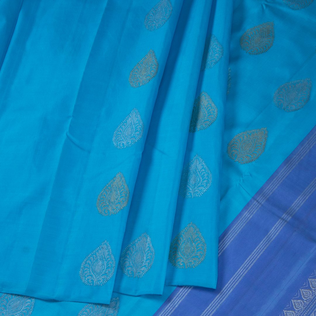 Sky Blue Borderless Silk Saree With Silver And Gold Buttas