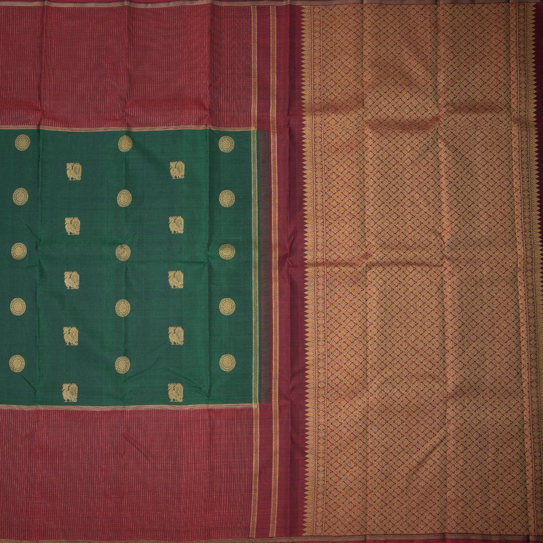 Green Silk Saree With Chakra And Peacock Buttas And Striped Border