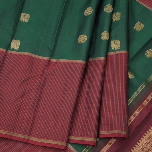 Green Silk Saree With Chakra And Peacock Buttas And Striped Border