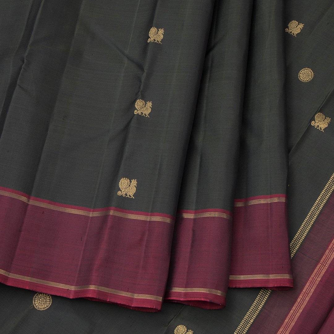 Bottle Green Silk Saree With Mango And Peacock Buttas And Maroon Border