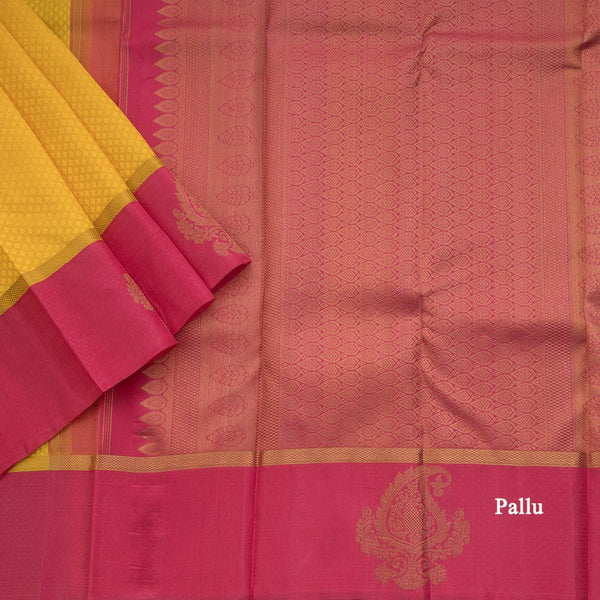 Lemon Yellow Embossed Kanchipuram Silk Saree With Contrast Pink Border