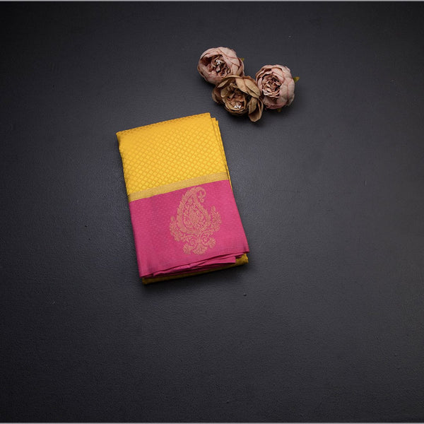 Lemon Yellow Embossed Kanchipuram Silk Saree With Contrast Pink Border