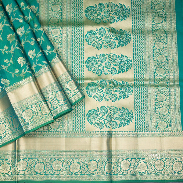Dark Green Soft Silk Saree With Floral Pattern On The Body