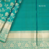Dark Green Soft Silk Saree With Floral Pattern On The Body