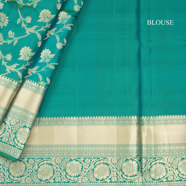 Dark Green Soft Silk Saree With Floral Pattern On The Body