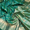 Dark Green Soft Silk Saree With Floral Pattern On The Body