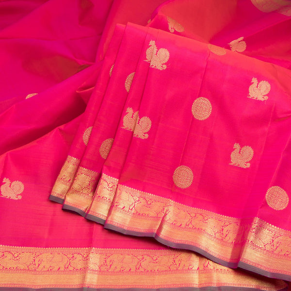 Rani Pink Silk Saree With Peacock And Chakra Buttas And Gold Zari Border