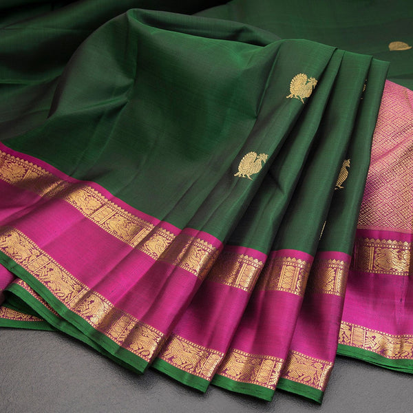 Bottle Green Silk Saree With Peacock And Chakra Buttas And Rettapet Border