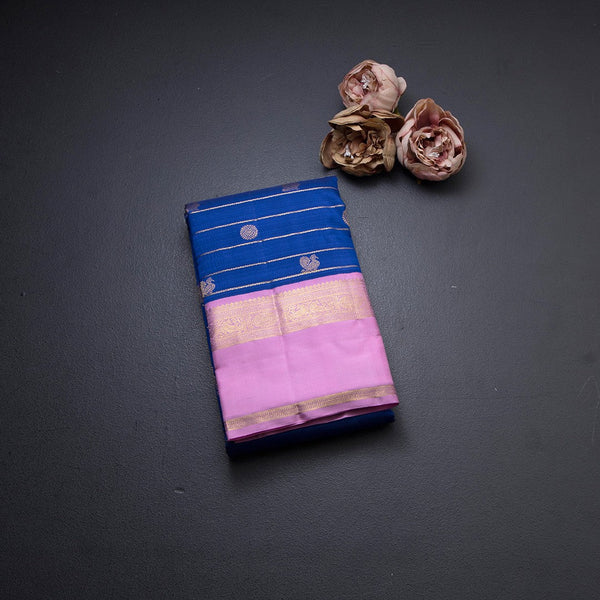 Ink Blue Silk Saree With Zig Zag Design And Peacock And Chakra Buttas And Pink Border