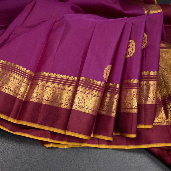 Magenta Silk Saree With Animal Motif On The Body And Zari With Thread Embossed Border