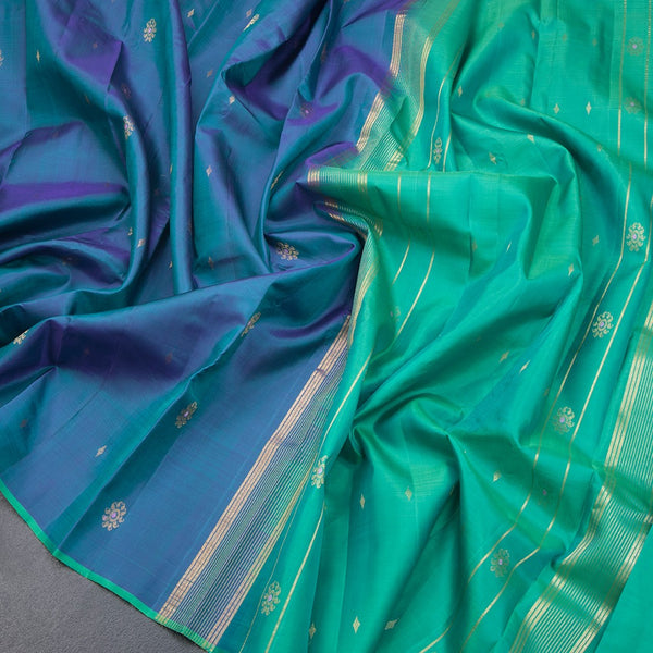 Shot Colour Borderless Silk Saree With Floral Zari Buttas On The Body