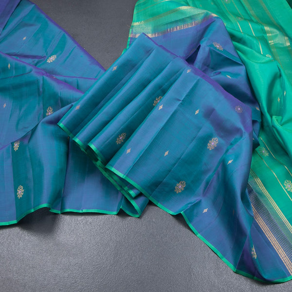 Shot Colour Borderless Silk Saree With Floral Zari Buttas On The Body