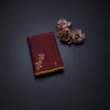 Maroon Borderless Silk Saree With Floral Zari Buttas On The Body