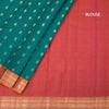 Peacock Green Soft Silk Saree With Peacock Buttas On The Body And Orange Zari Border