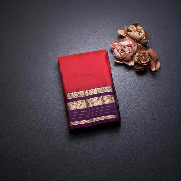 Red Silk Saree With Chakra Buttas On The Body And Purple Zari Border