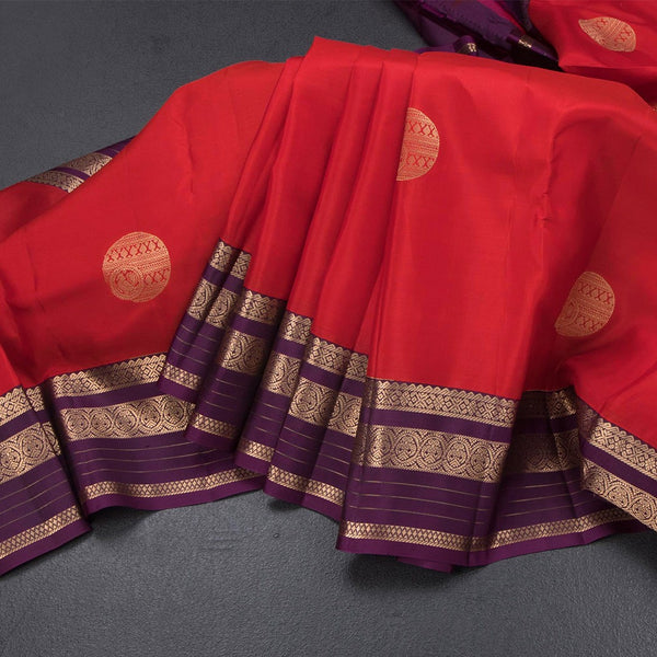 Red Silk Saree With Chakra Buttas On The Body And Purple Zari Border