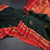 Bottle Green Silk Saree With Chakra Buttas On The Body And Red Zari Border