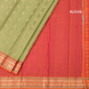 Pista Green Soft Silk Saree With Peacock Buttas On The Body And Orange Zari Border