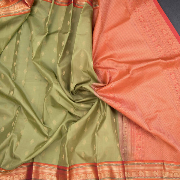 Pista Green Soft Silk Saree With Peacock Buttas On The Body And Orange Zari Border