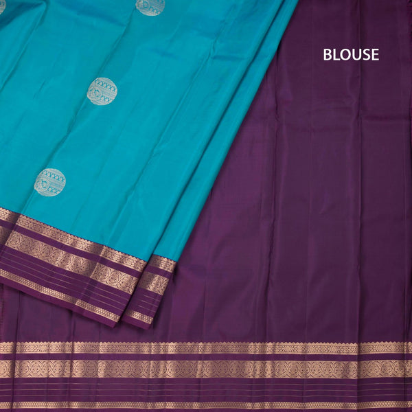 Peacock Blue Silk Saree With Chakra Buttas On The Body And Purple Zari Border