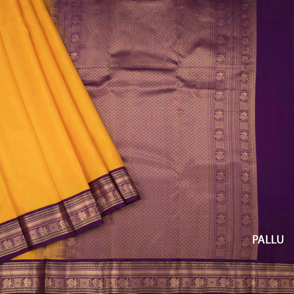 Mango Yellow Soft Silk Saree With Peacock Buttas On The Body And Purple Zari Border