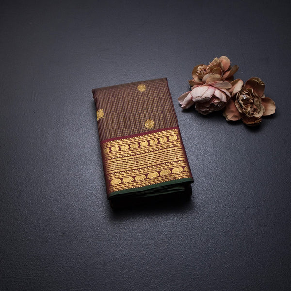 Vairaoosi Dark Brown Silk Saree With Peacock And Chakra Buttas And Gold Zari Border