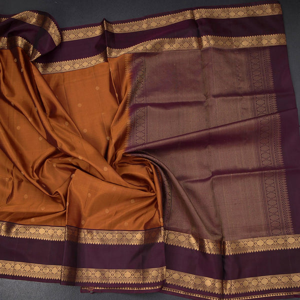 Rust Orange Soft Silk Saree With Chakra Buttas And Rettapet Border